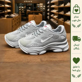 کفش کتانی زنانه نایک مدل نیو فیس رنگ طوسی سفید رویه بافت زیره پلیمر نرم و سبک