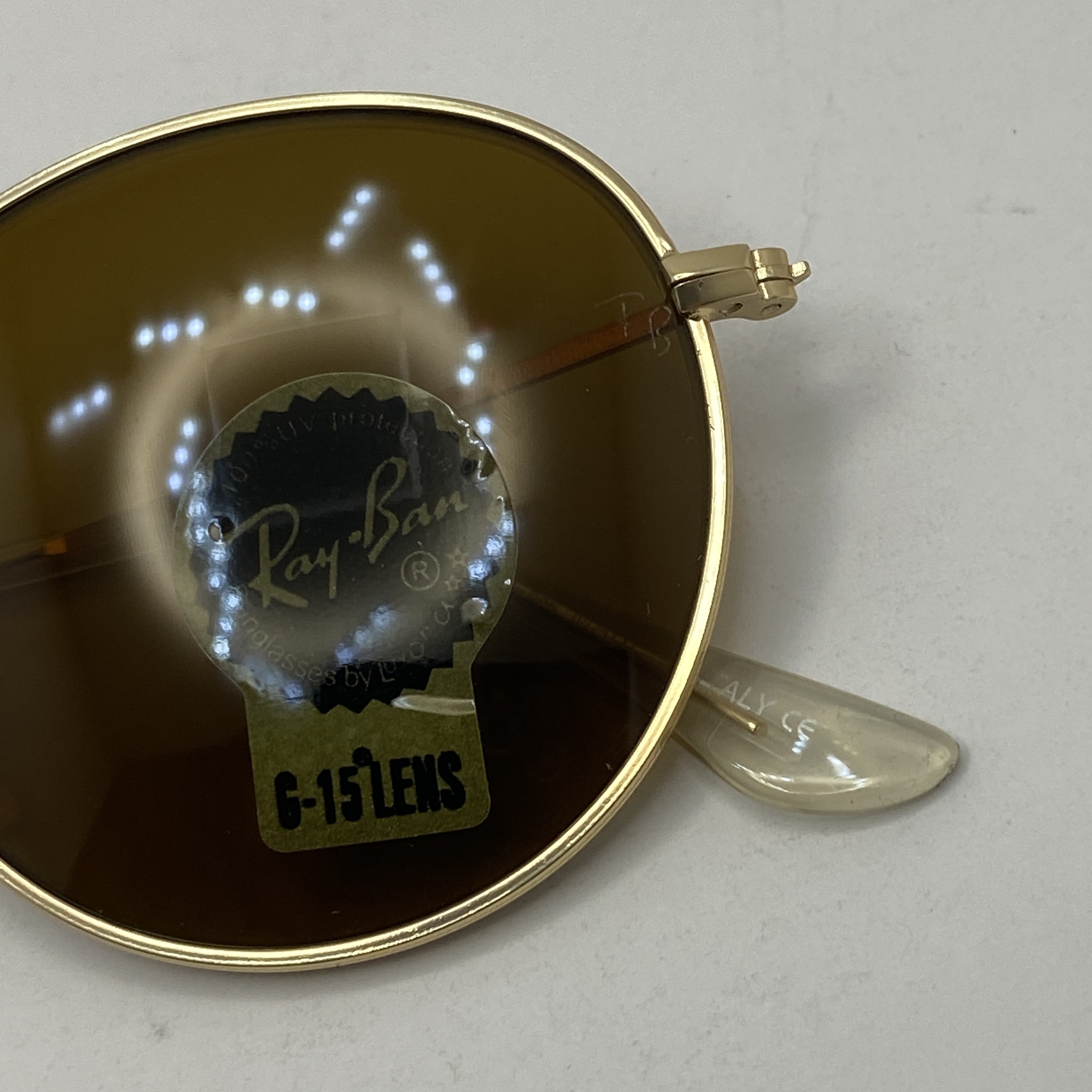 عینک آفتابی ریبن rayban گرد قهوه ای طلایی RB 3447