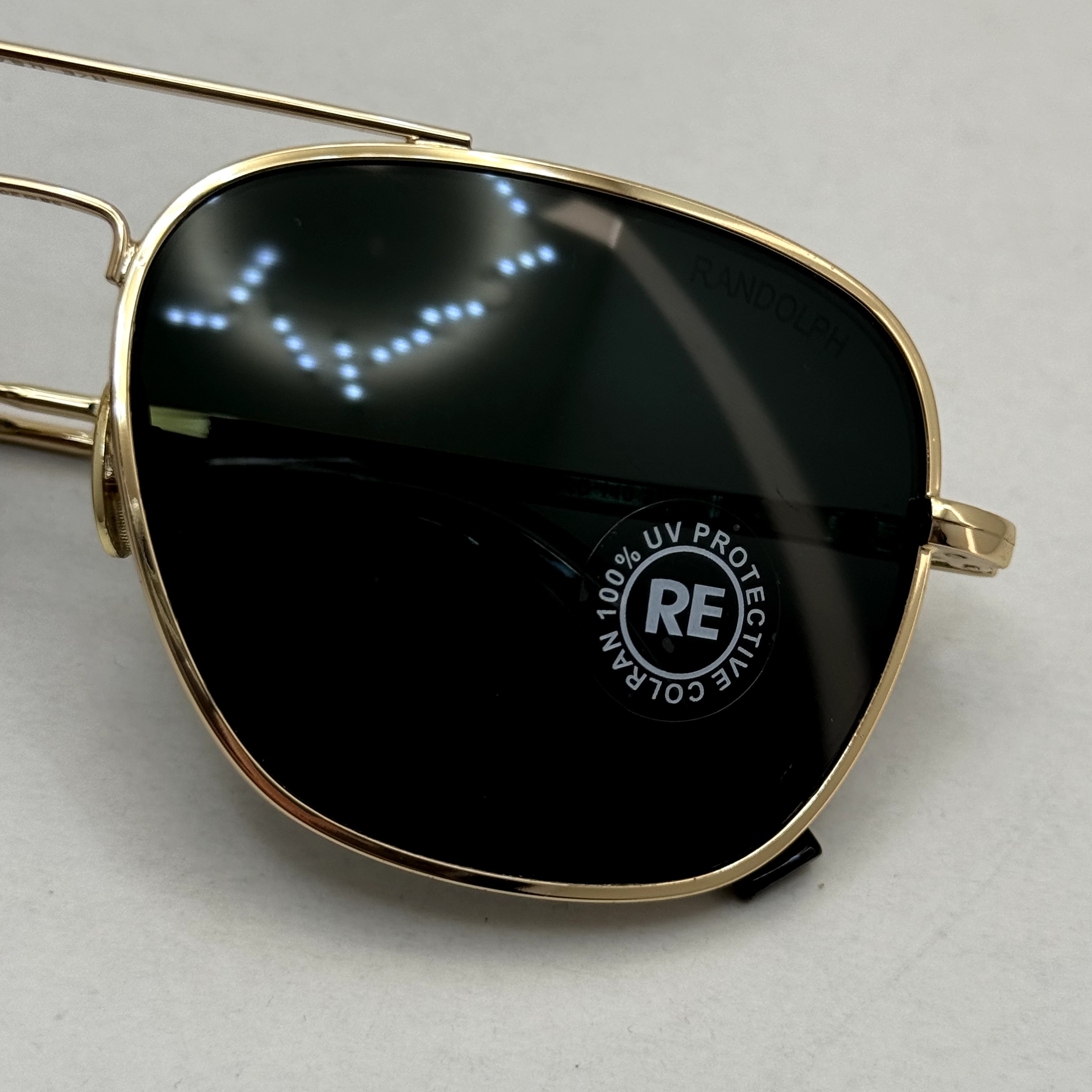 عینک آفتابی خلبانی رندولف شیشه سنگ آنتی رفلکس مشکی فریم طلایی فول پک RANDOLPH AVIATOR RE 58 24K GOLD (ارسال رایگان)