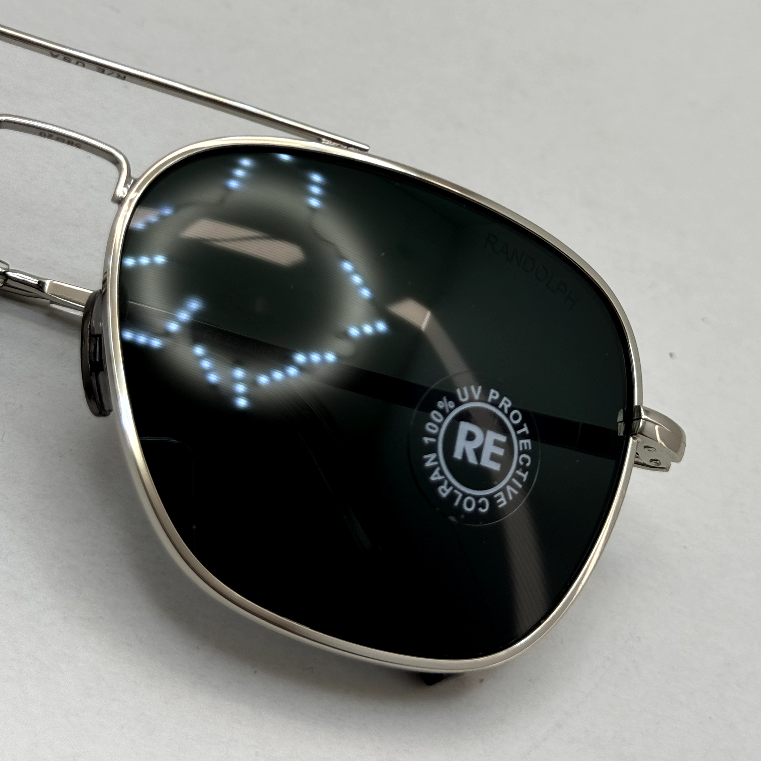 عینک آفتابی خلبانی رندولف شیشه سنگ آنتی رفلکس مشکی فریم نقره ای فول پک RANDOLPH AVIATOR RE 58 WHITE GOLD (ارسال رایگان)