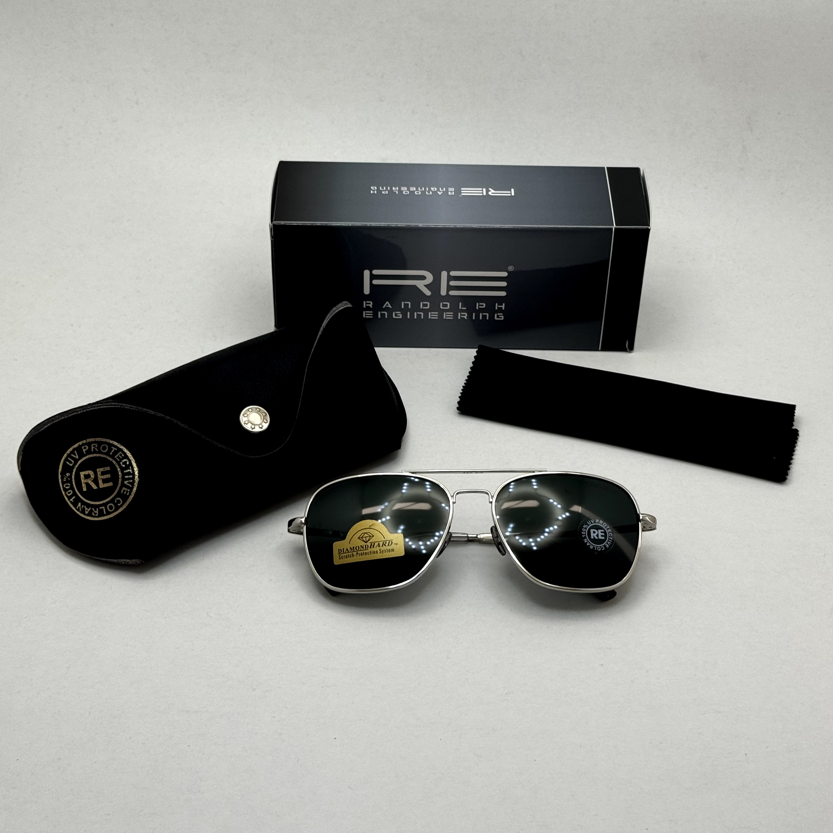 عینک آفتابی خلبانی رندولف شیشه سنگ آنتی رفلکس مشکی فریم نقره ای فول پک RANDOLPH AVIATOR RE 58 WHITE GOLD (ارسال رایگان)