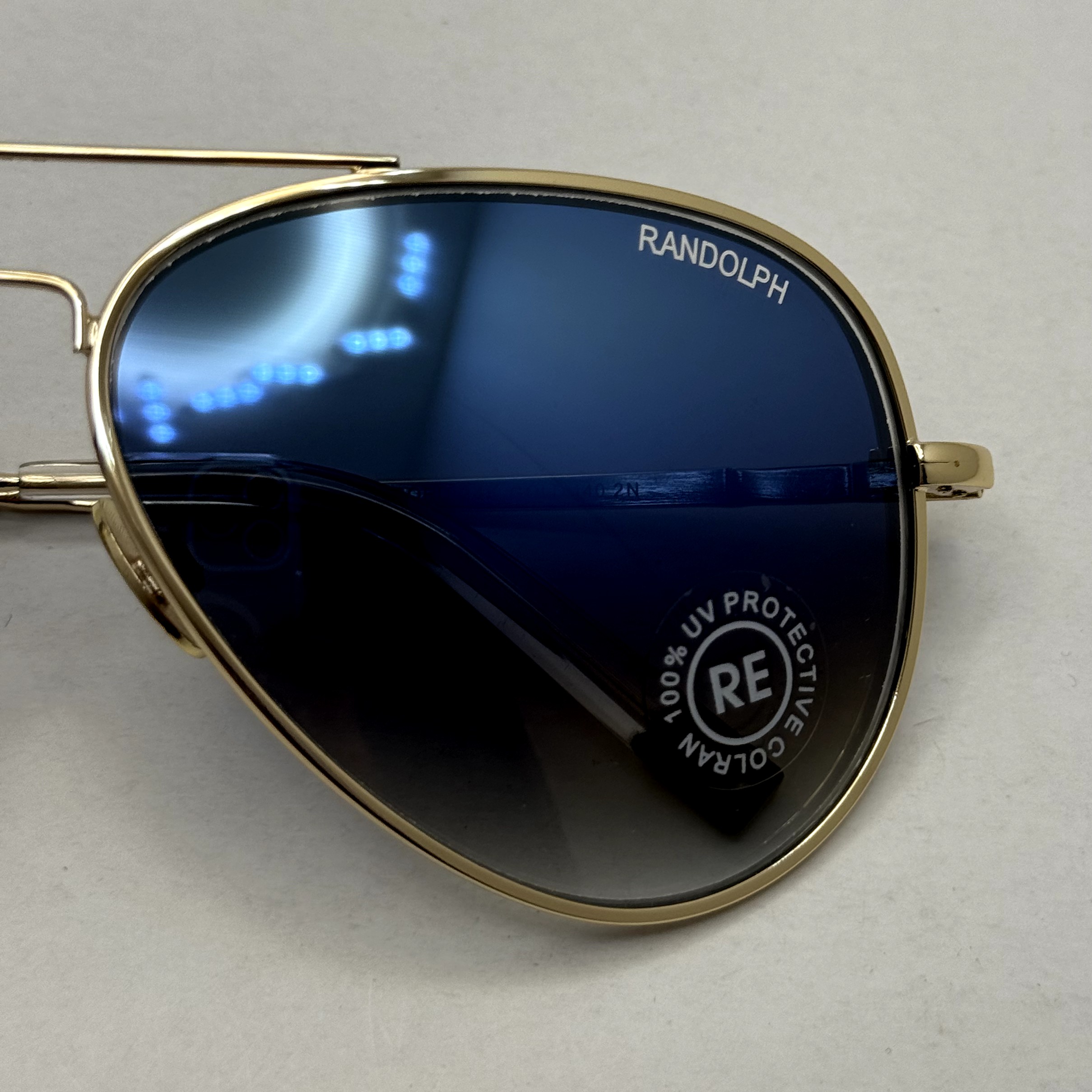 عینک آفتابی و شب خلبانی رندولف شیشه سنگ مدل کانکورد آبی فریم طلایی فول پک RANDOLPH CONCORD CR 231 24K GOLD (ارسال