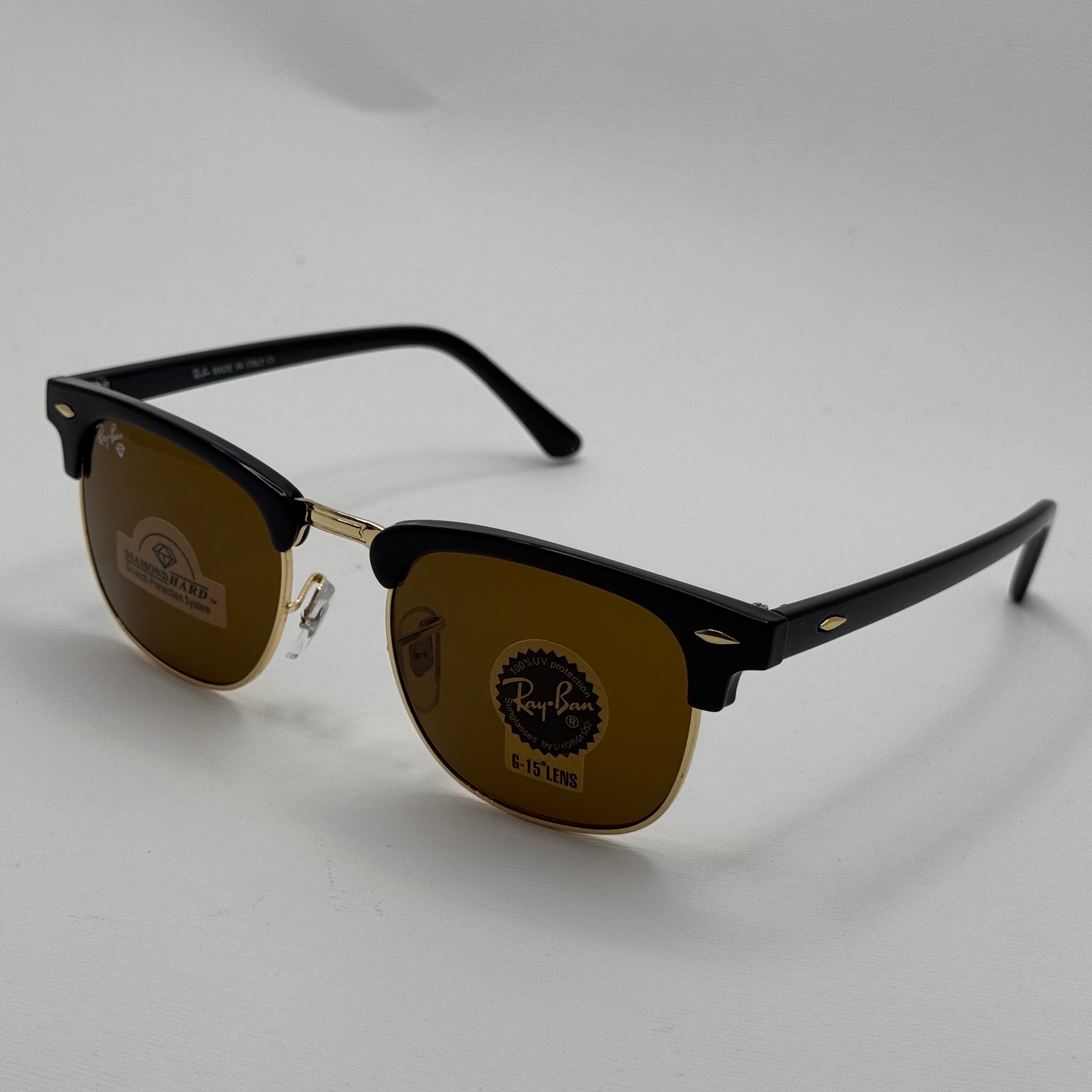 عینک آفتابی ریبن rayban کلاب مستر شیشه سنگ قهوه ای فریم طلایی rb 3016 به همراه پک کامل (ارسال رایگان)