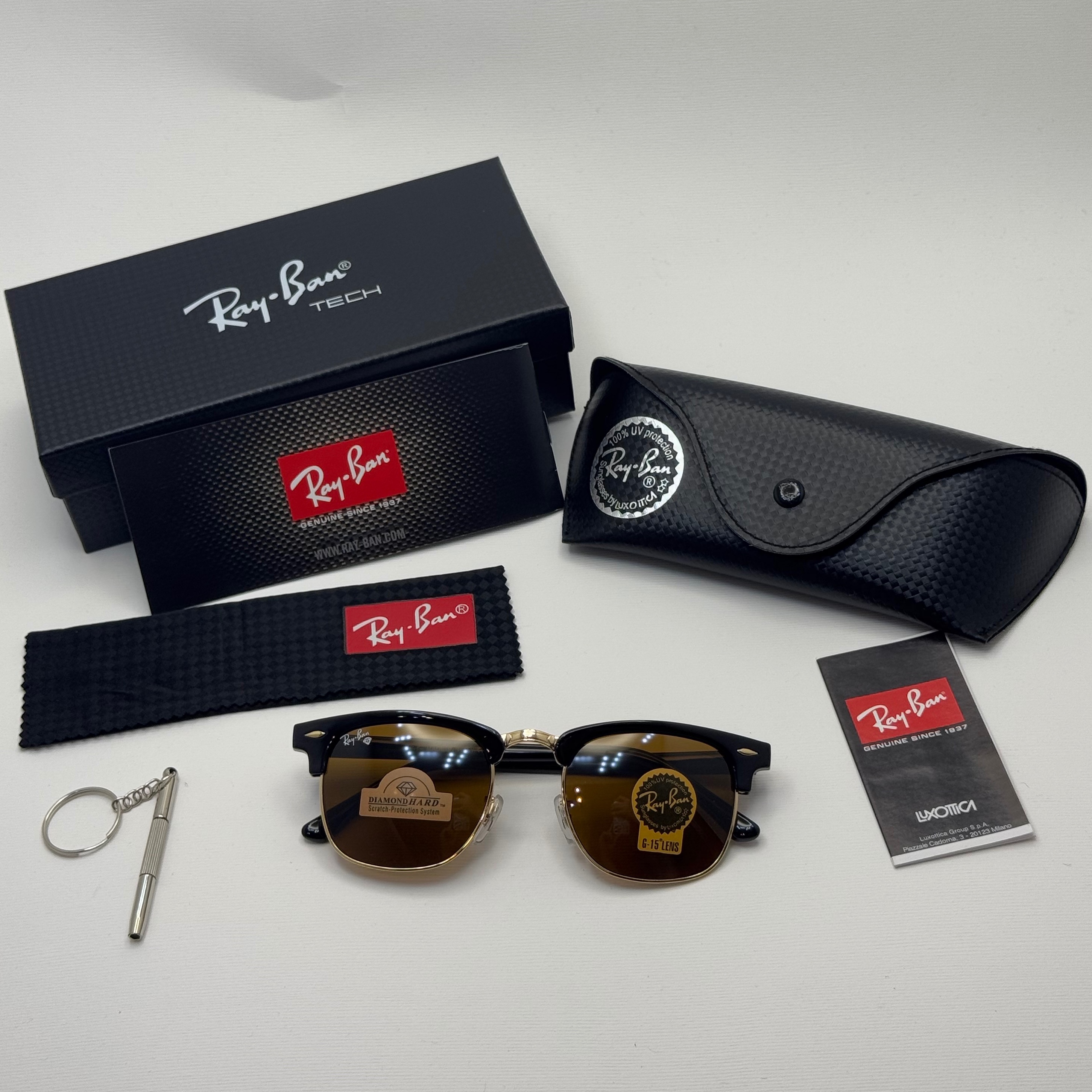 عینک آفتابی ریبن rayban کلاب مستر شیشه سنگ قهوه ای فریم طلایی rb 3016 به همراه پک کامل (ارسال رایگان)
