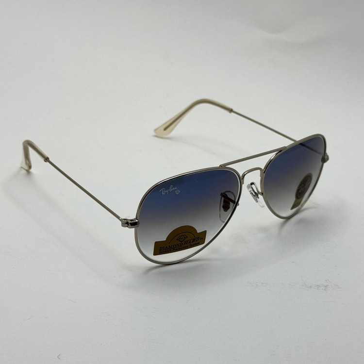 عینک ریبن خلبانی شیشه سنگ آبی هایلایت فریم نقره ای به همراه پک کامل ریبن Rayban RB 3025 (ارسال رایگان)
