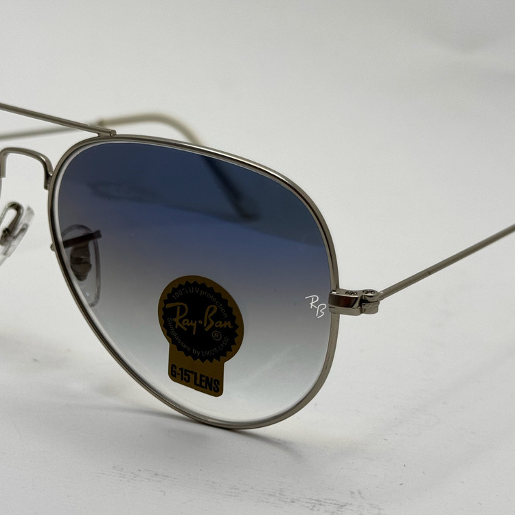 عینک ریبن خلبانی شیشه سنگ آبی هایلایت فریم نقره ای به همراه پک کامل ریبن Rayban RB 3025 (ارسال رایگان)
