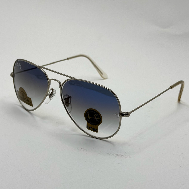 عینک ریبن خلبانی شیشه سنگ آبی هایلایت فریم نقره ای به همراه پک کامل ریبن کد Rayban RB 3025 (ارسال رایگان)