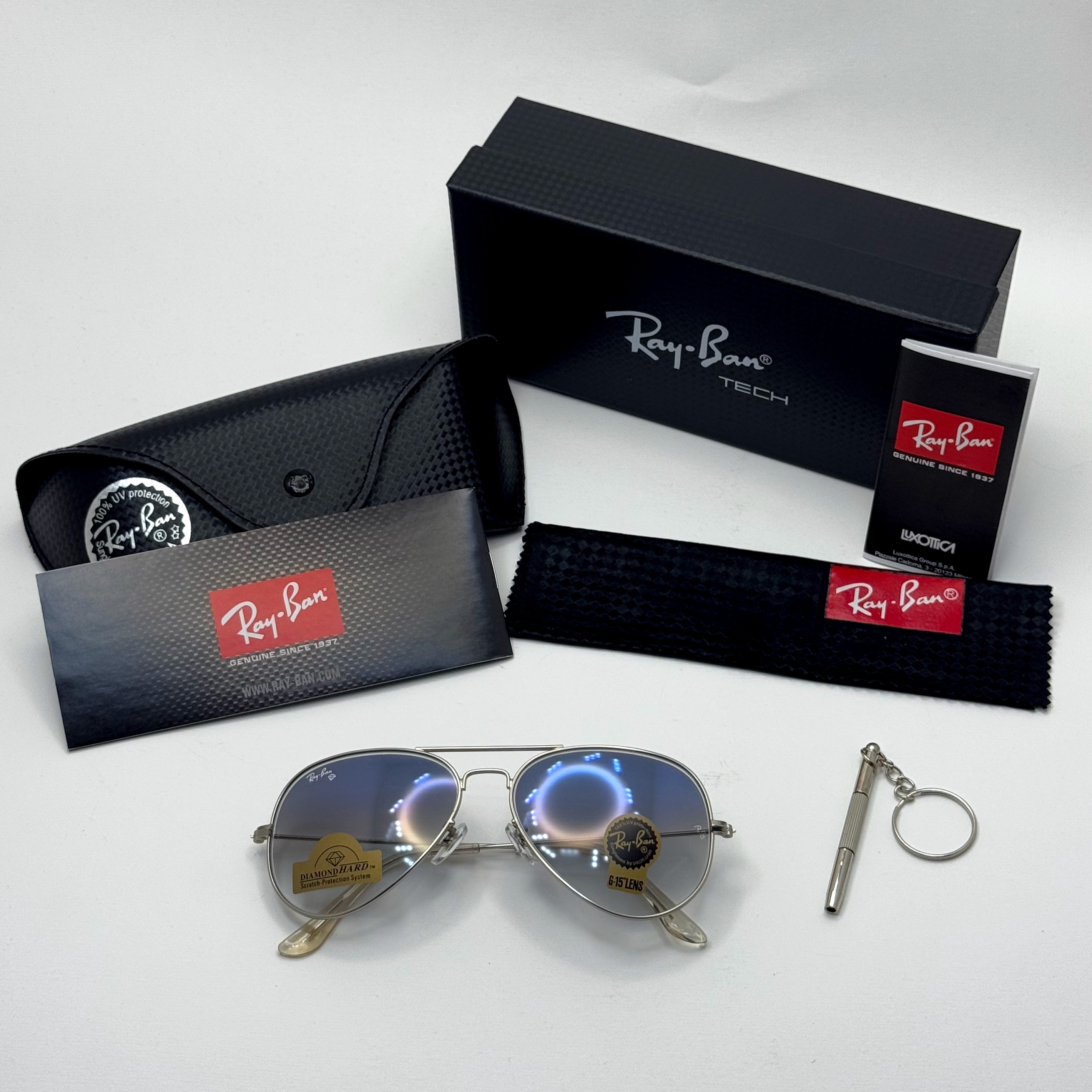 عینک ریبن خلبانی شیشه سنگ آبی هایلایت فریم نقره ای به همراه پک کامل ریبن کد Rayban RB 3025 (ارسال رایگان)