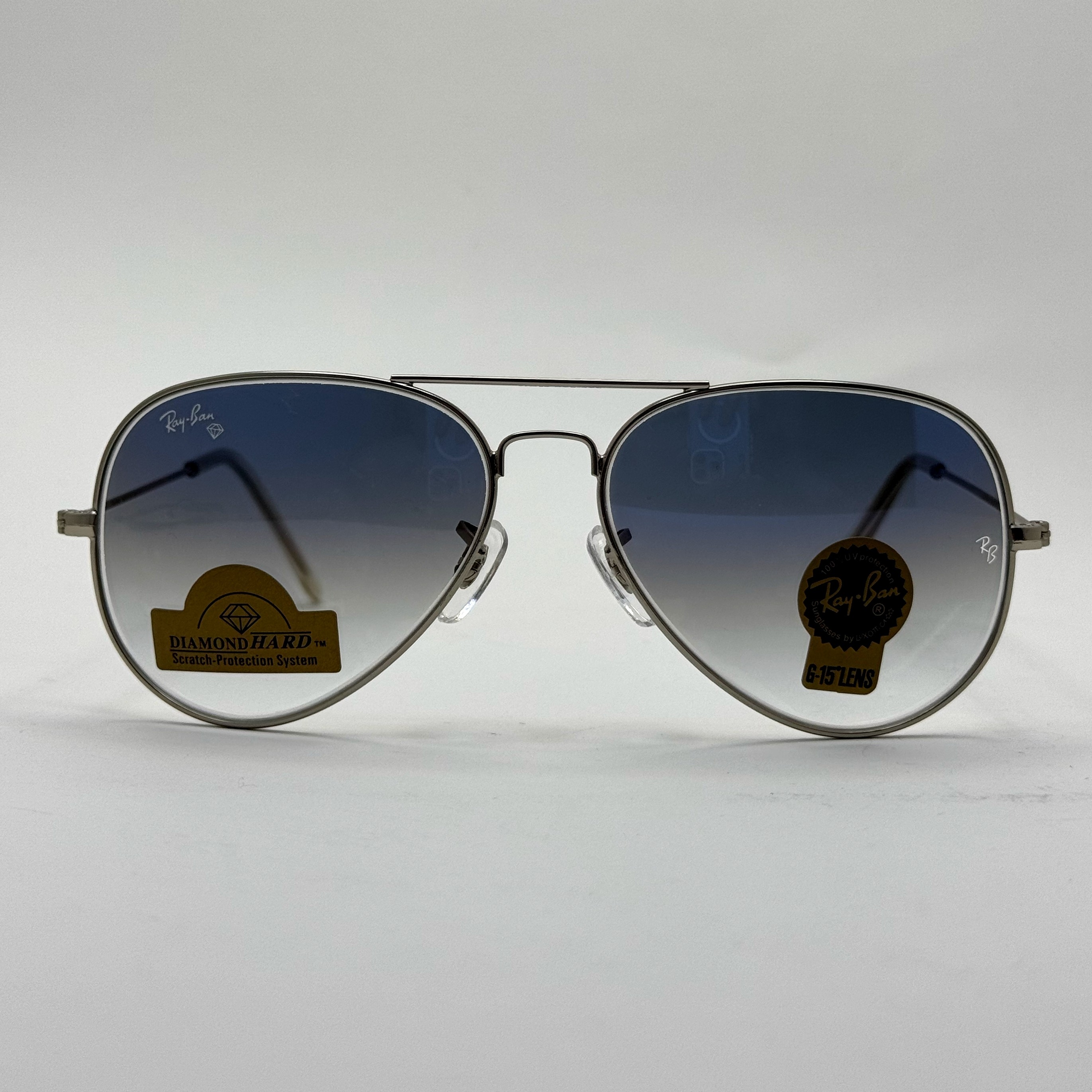 عینک ریبن خلبانی شیشه سنگ آبی هایلایت فریم نقره ای به همراه پک کامل ریبن کد Rayban RB 3025 (ارسال رایگان)