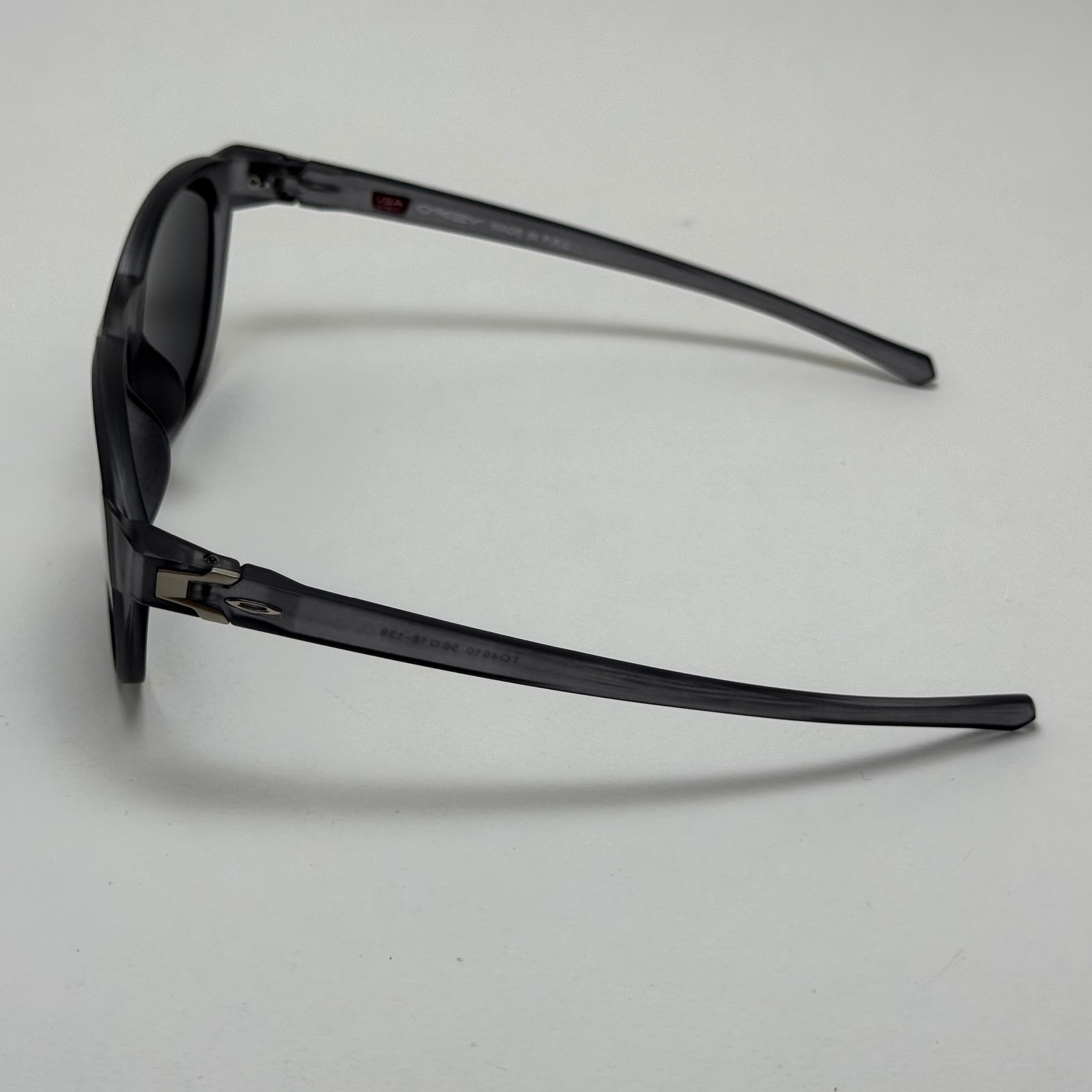 عینک آفتابی پلاریزه اوکلی Oakley طوسی عدسی مشکی گرد کد TO4910 (ارسال رایگان)