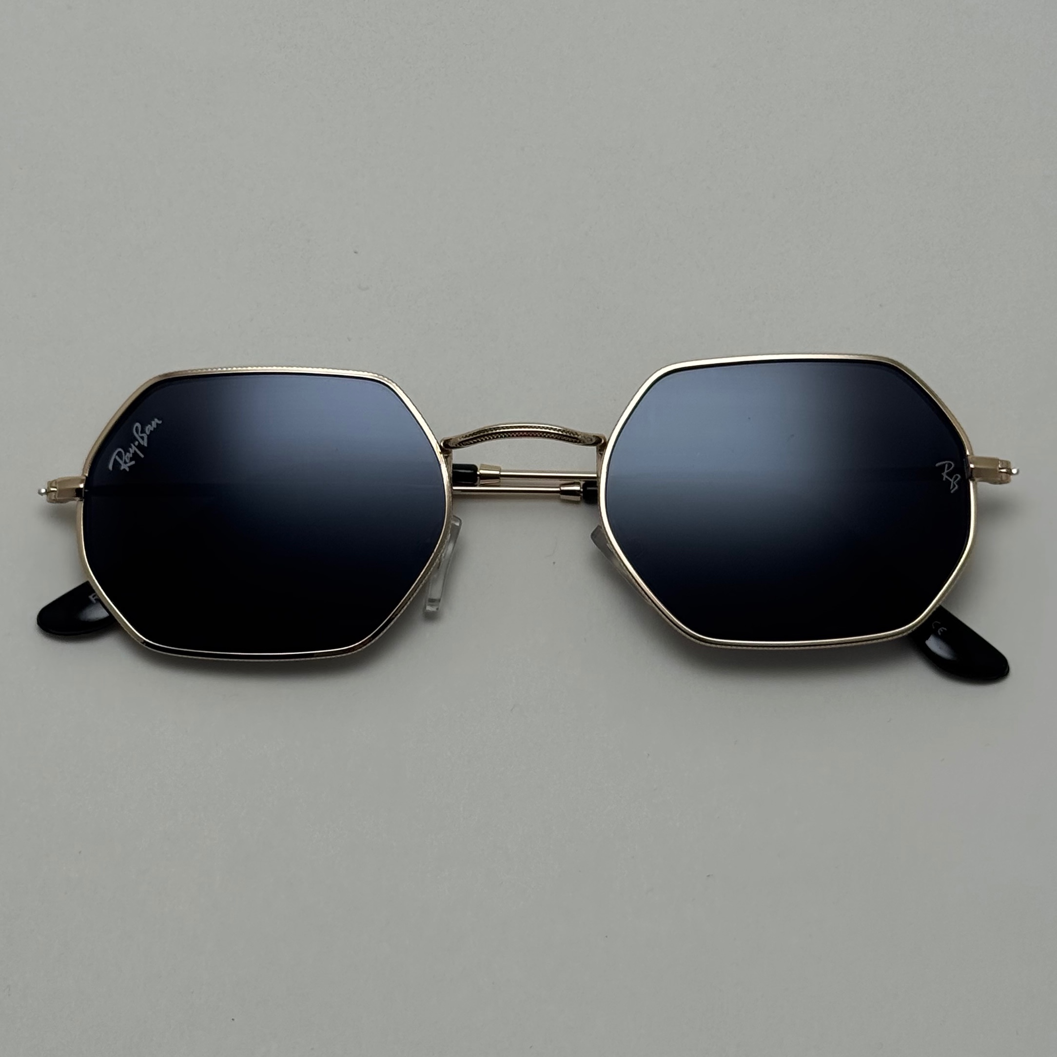 عینک آفتابی ریبن Ray-ban شش ضلعی مشکی طلایی سبک کد RB 3556